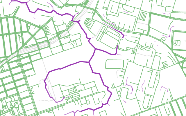 The same streets, with strong purple lines along the creek's branches, where few streets cross