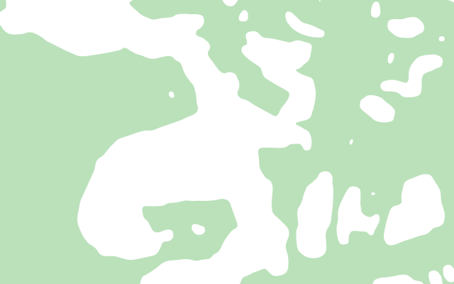 Ground around the branches of a creek shaded green, with the creek and the land along it left white
